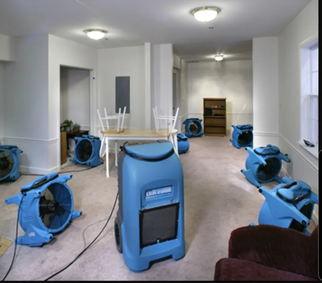 Air movers and dehumidifier setup for Water Damage Restoration in Isanti